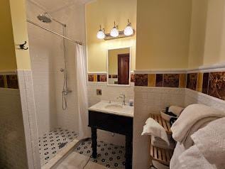 Bath with rain shower and heated towel rack