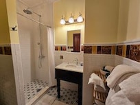 Bath with rain shower and heated towel rack