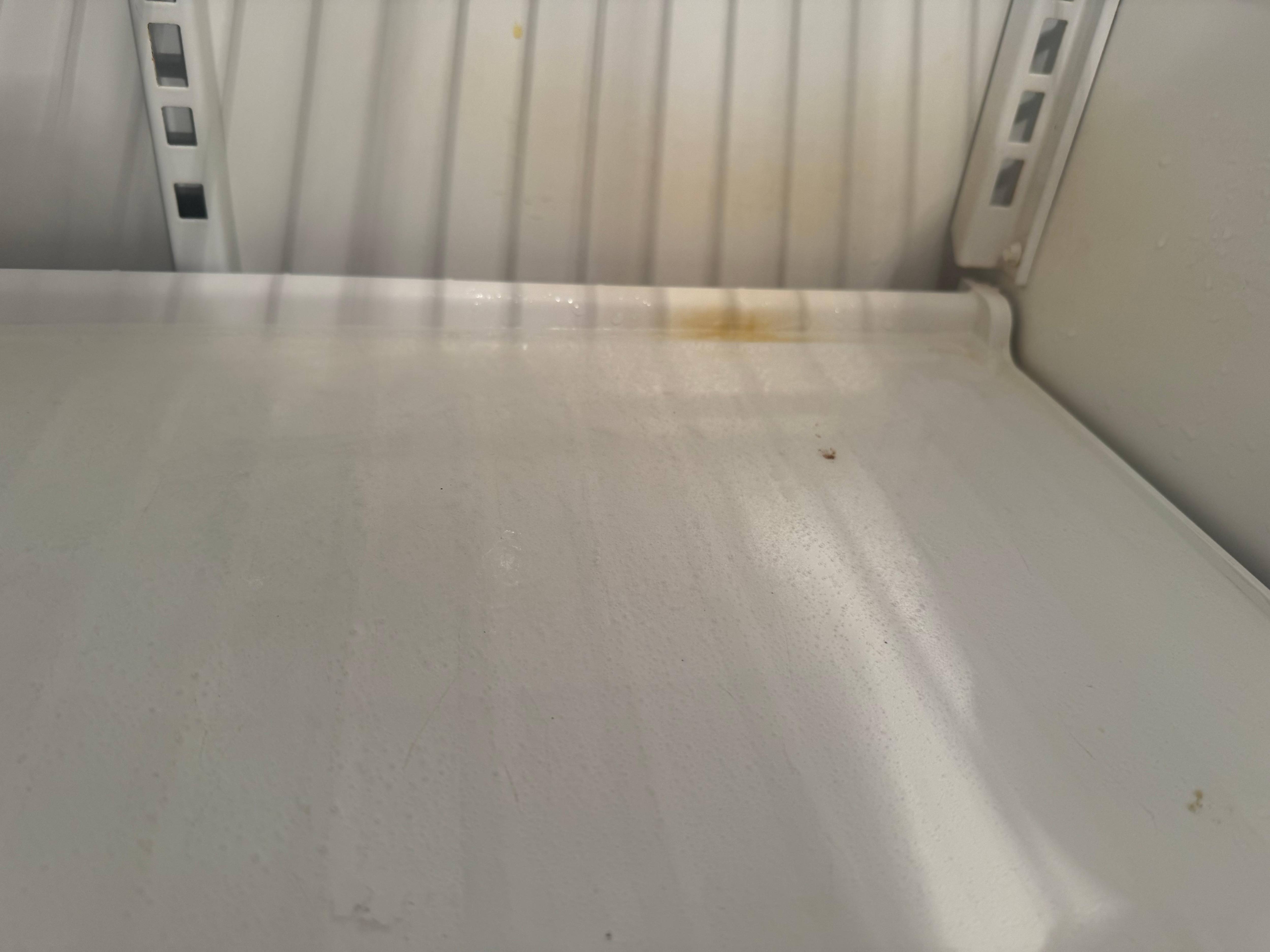 Spills on the refrigerator not cleaned up; refrigerator over-all looked like it needed to be wiped out.