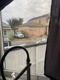 View from kitchen, this was taken in early morning but there were often people sitting/sleeping/using drugs here in evenings. We kept our shades drawn.