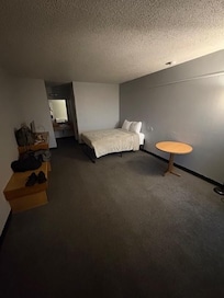 Sparse (no chairs or trash cans) but comfortable and if your just here to rest, what more do you need?