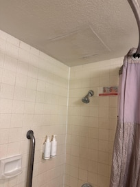 Ceiling bulging with water damage in shower