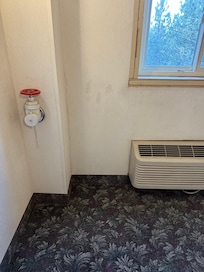 Stains on the walls. Windows are changed out but still unfinished.