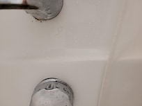 Pubic hair under bathtub tap
