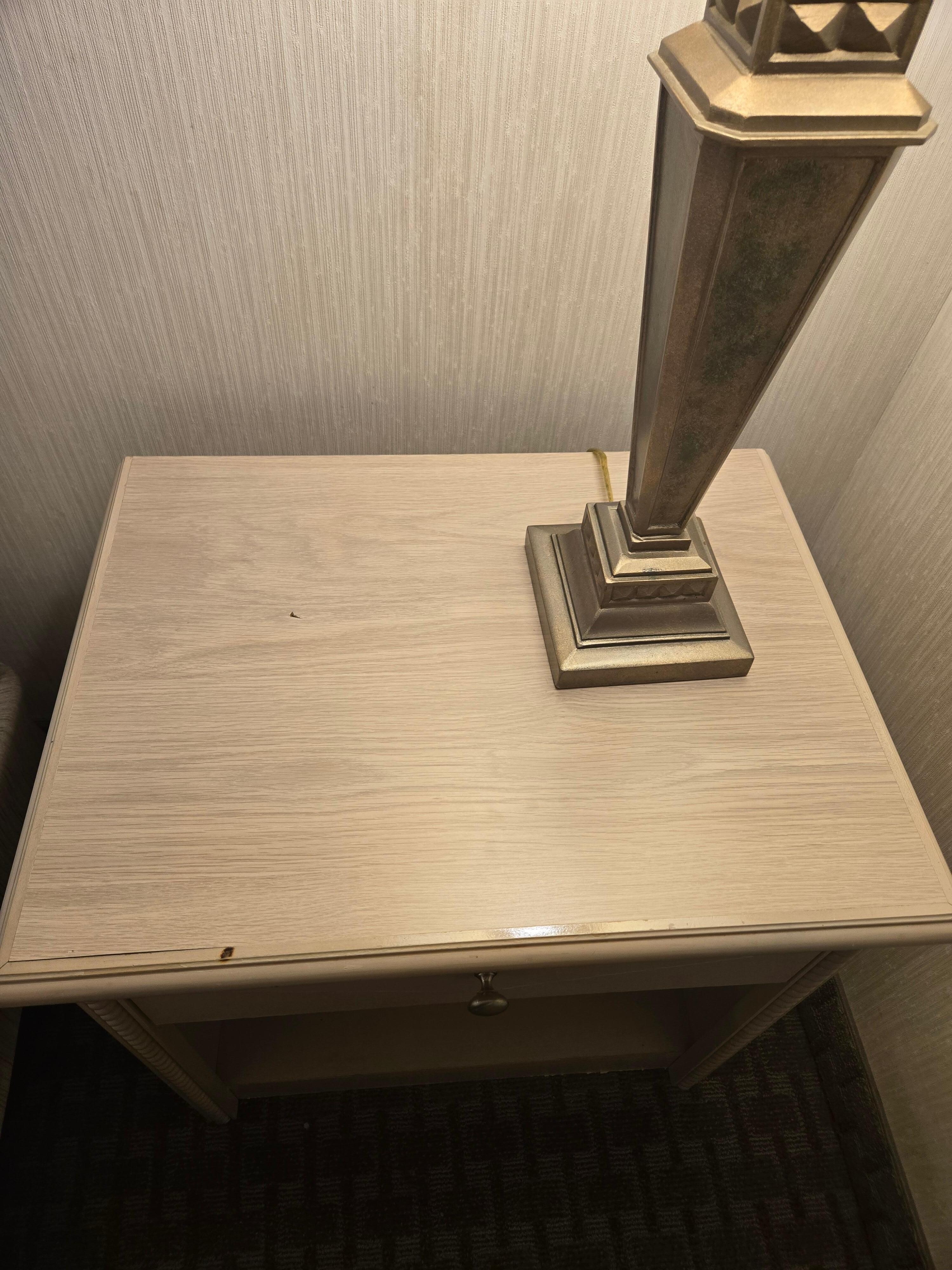 Cigarette burn on nightstand.