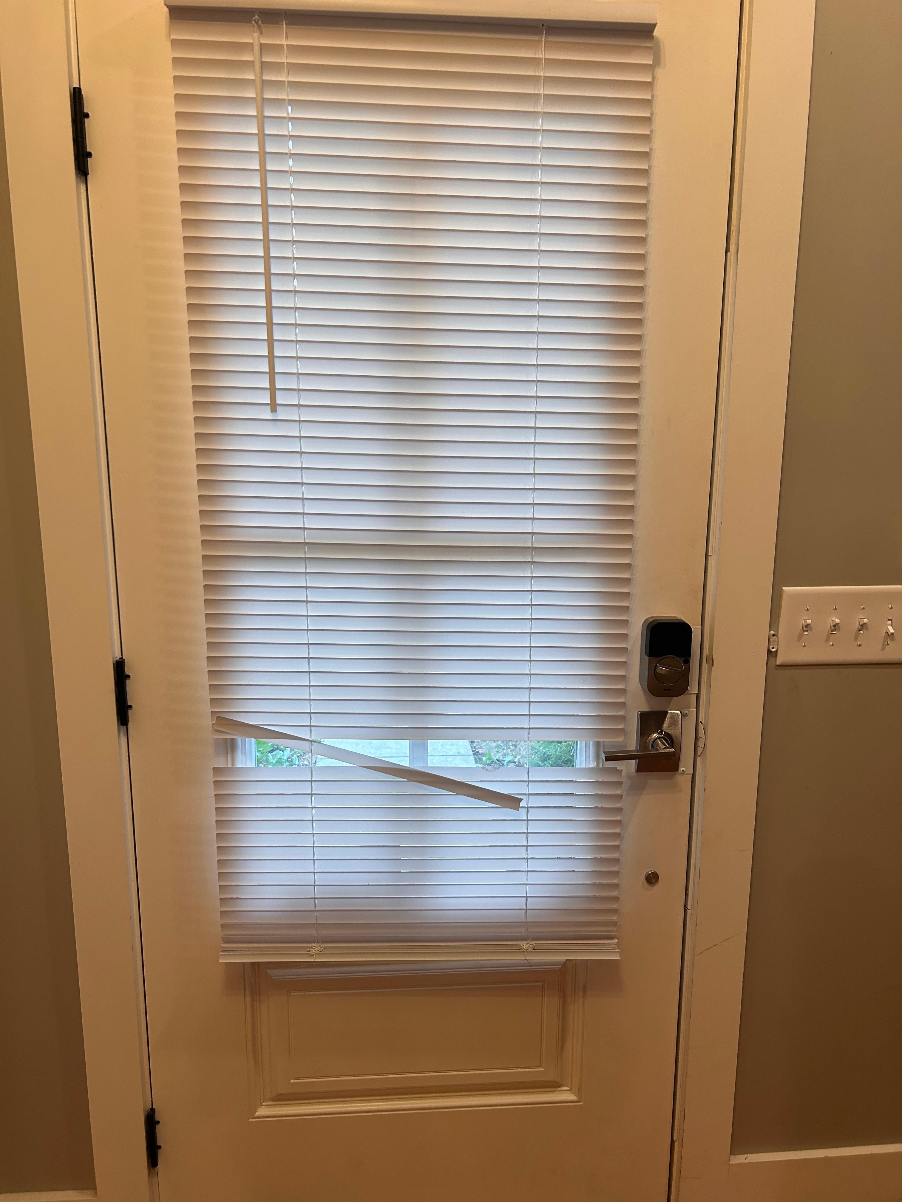 Broken slats on front door. 
