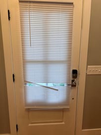 Broken slats on front door.