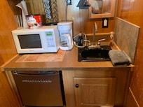 The sink for both kitchenette and bathroom