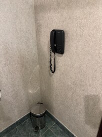 Wall phone in the bathroom to be used to order room service.