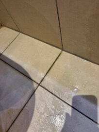 Each shower water on bathroom floor