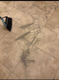 Sand and dirt under kitchen rug.