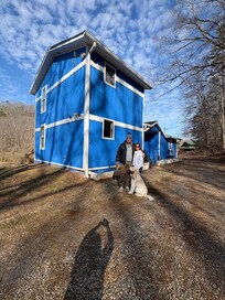 Sweet blue cottage on a beautiful day.