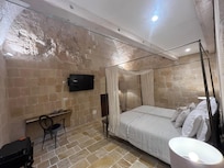 Queen bed at the rear of the ground floor.