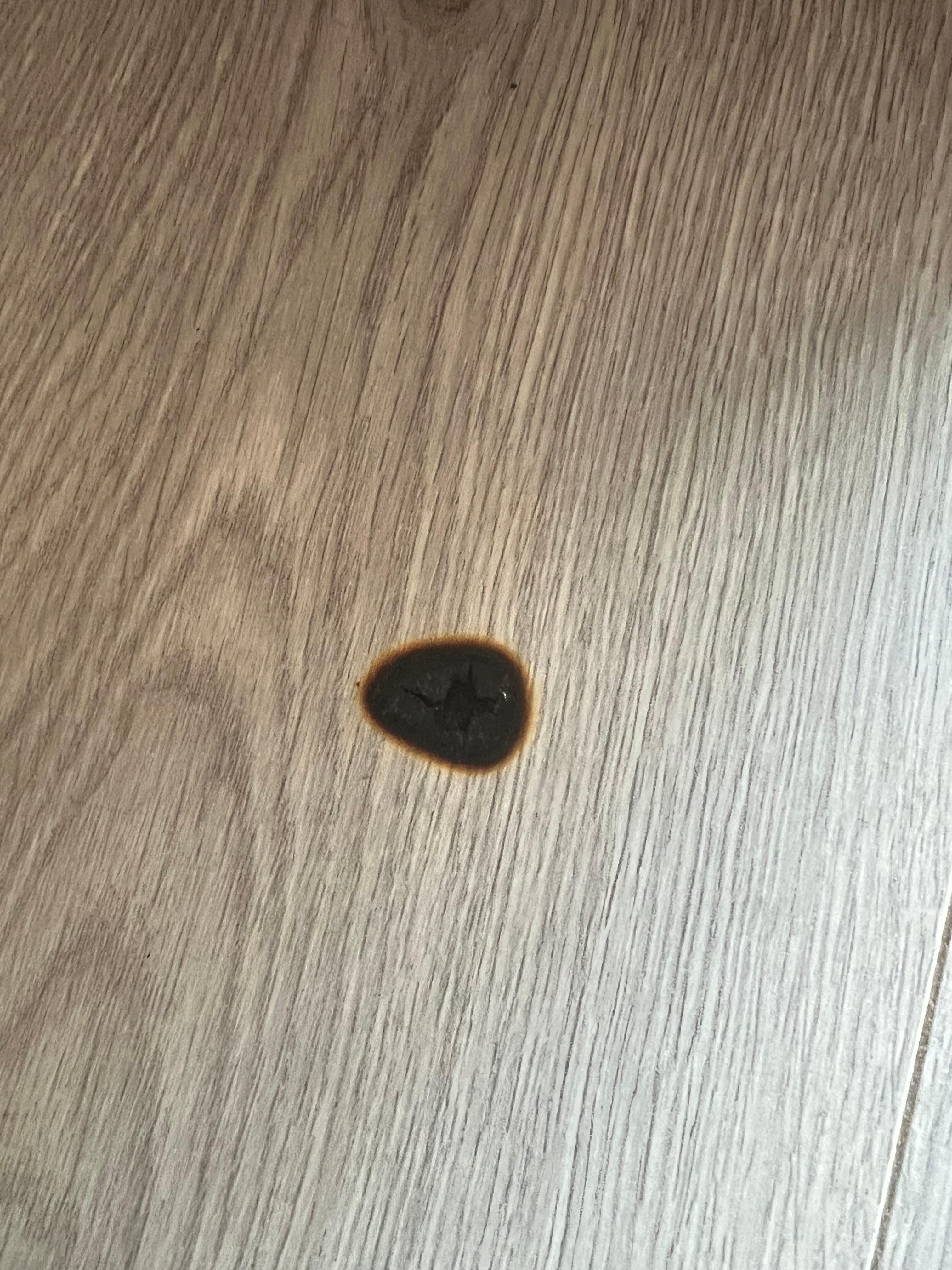 Burn hole in floor