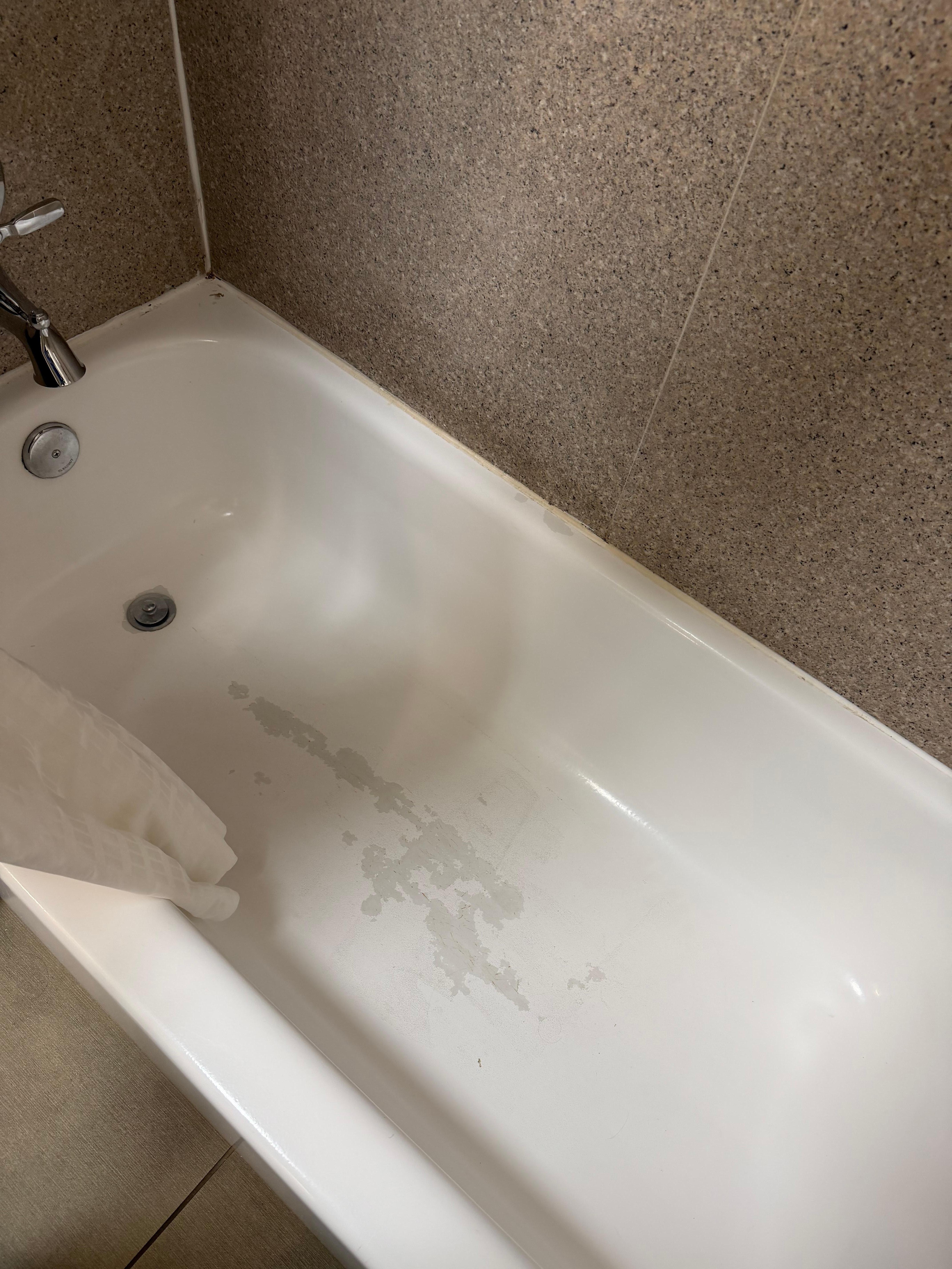 Bathtub, hair on floor  