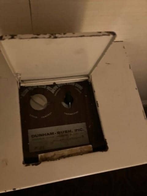 Rusty heating-cooling controls. 