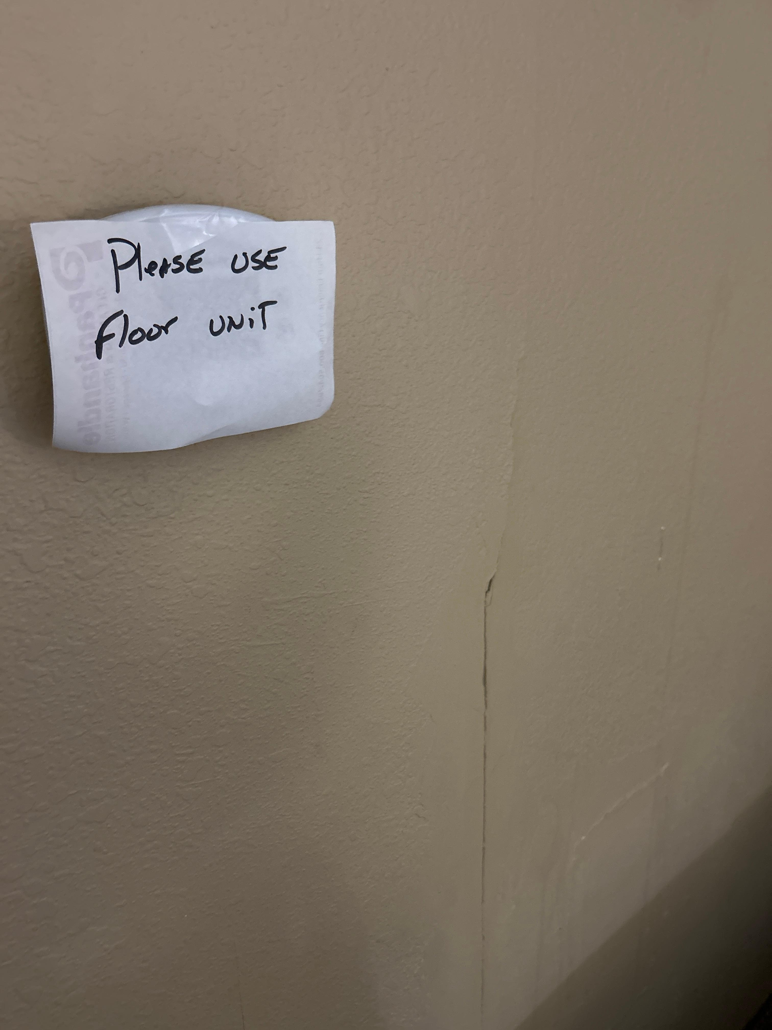 Cracked wall - and crazy sign