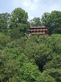View of the Lake n Logs taken from our boat on the lake! The boat dock is just a few minutes from the cabin.
