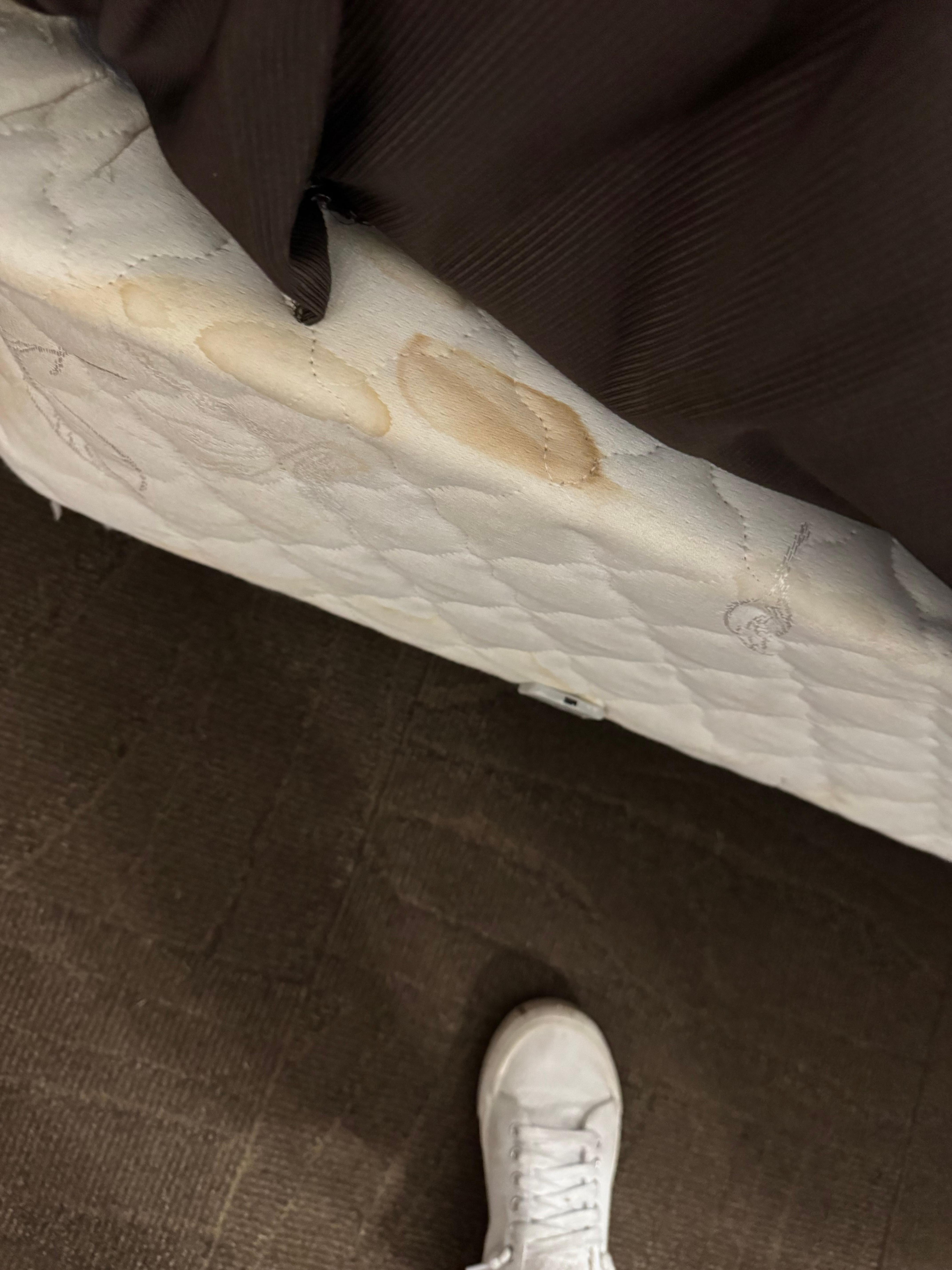 Staining on the box spring as well as the top comforter 