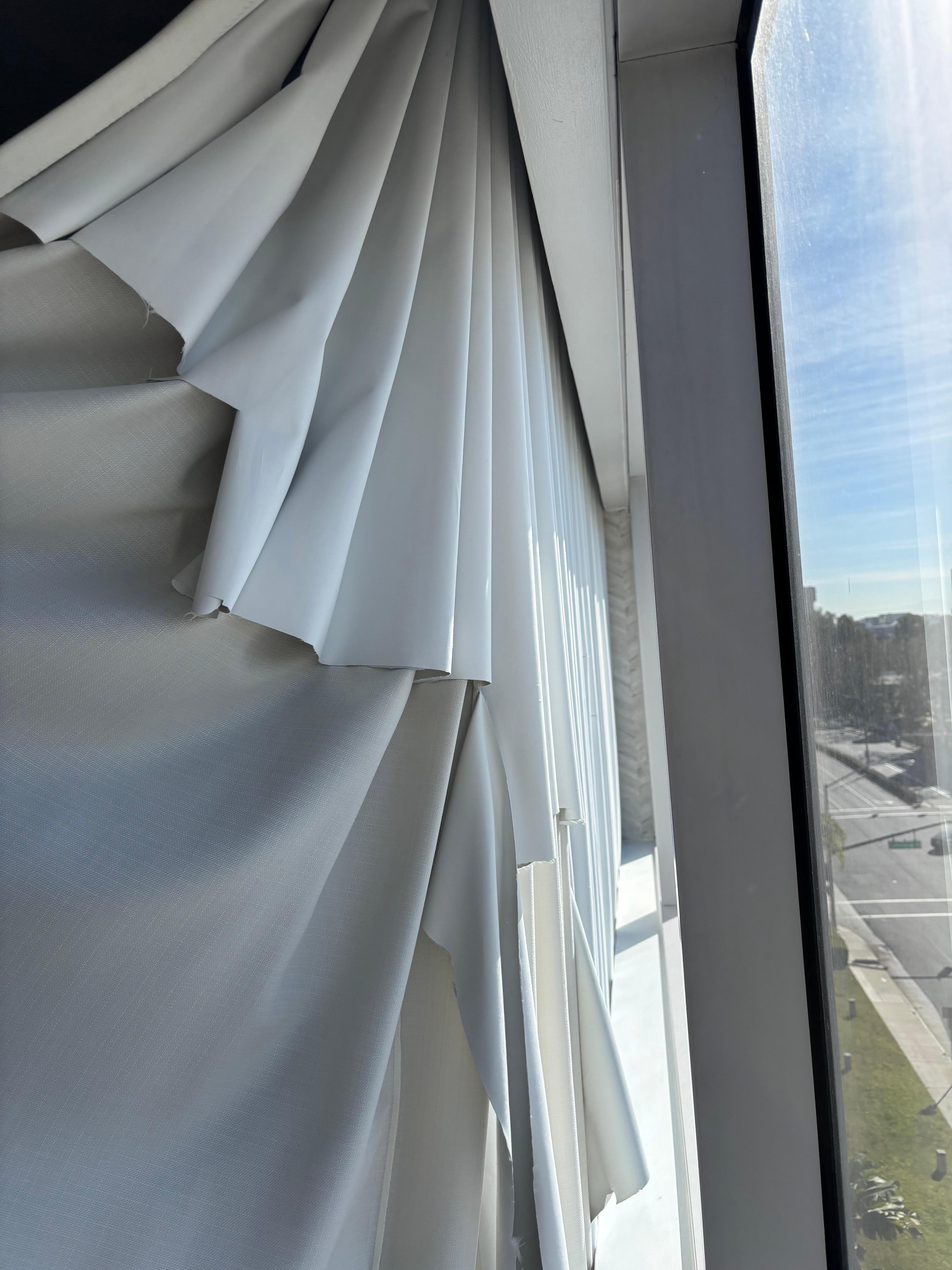Torn blackout curtain