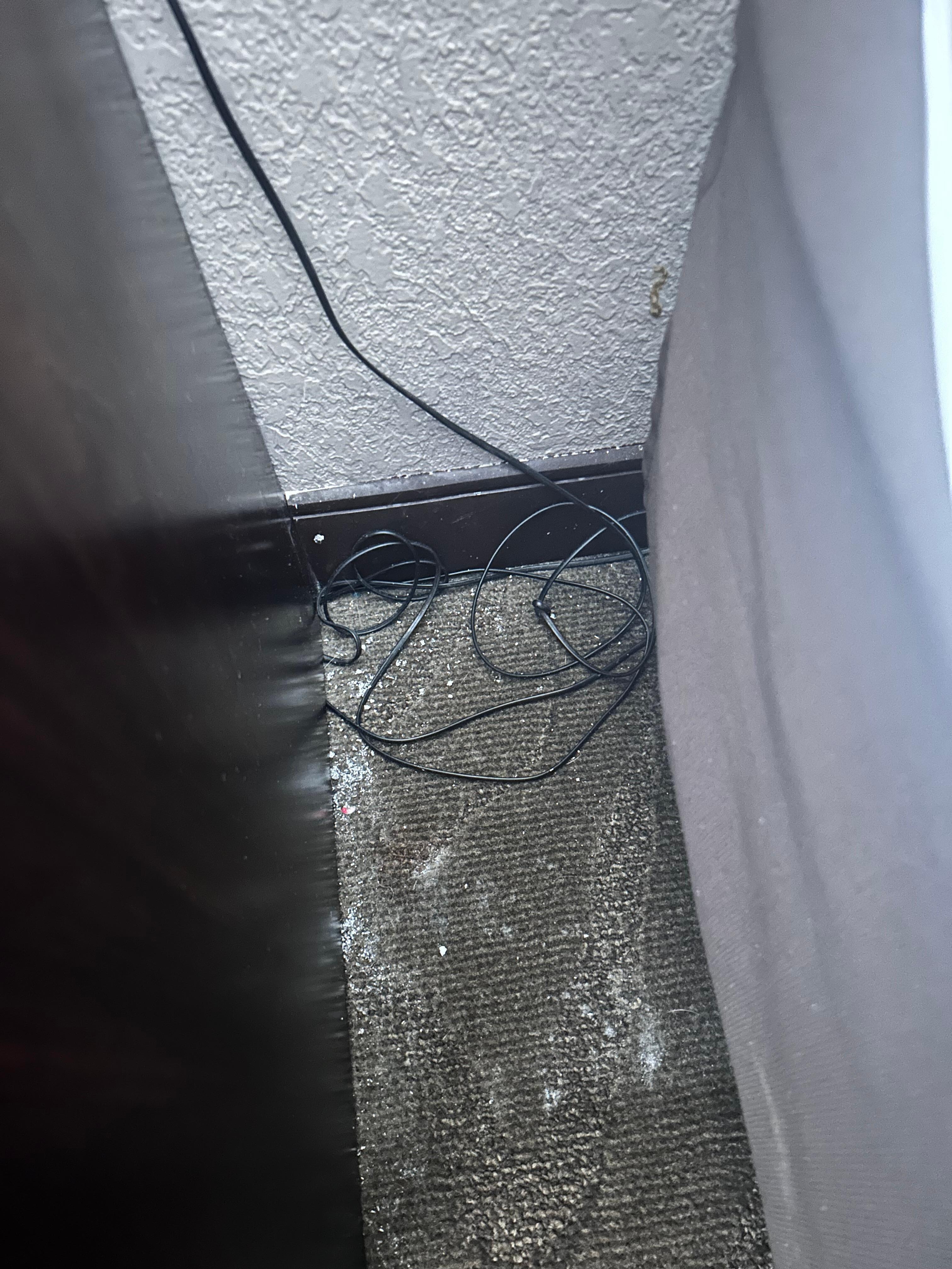 Cigarette ash next to bed 
