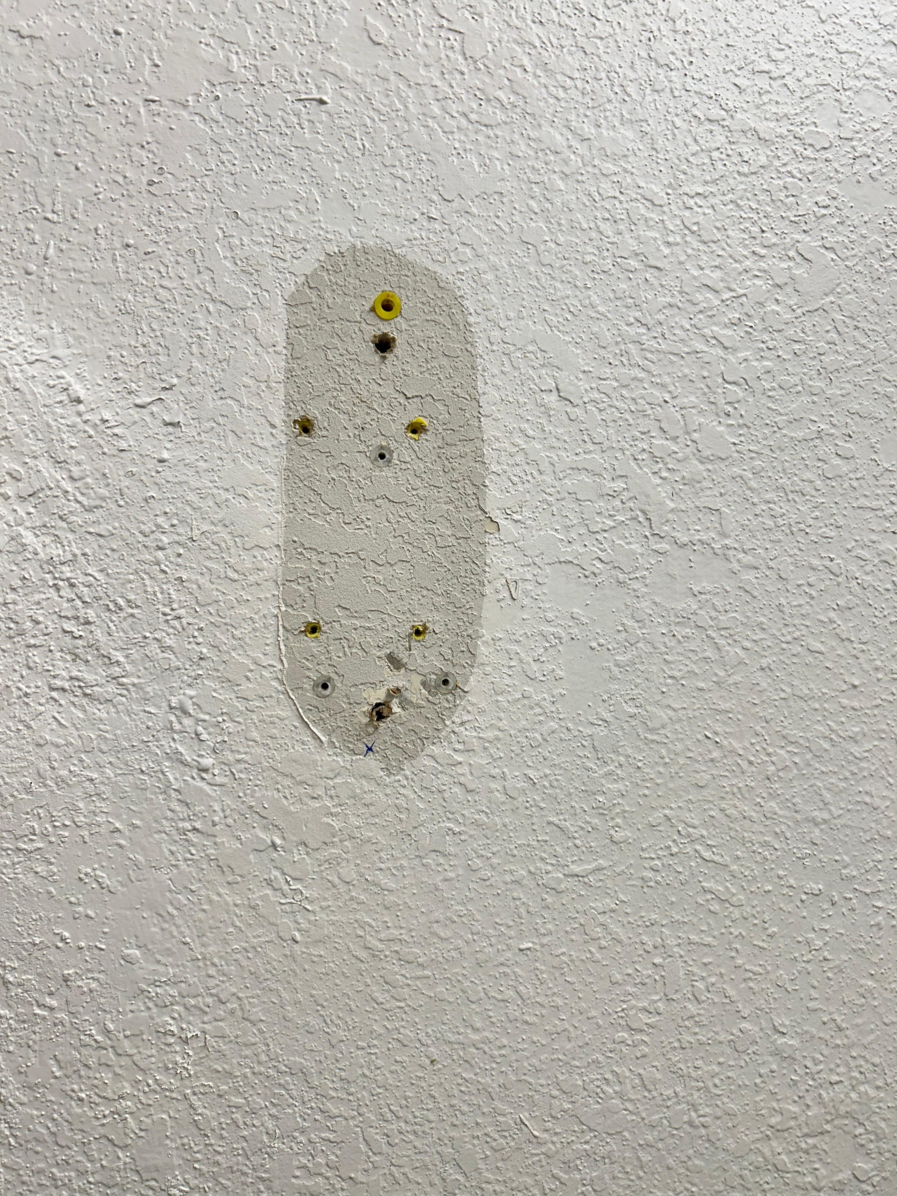 Where the hair dryer was hung but no longer there