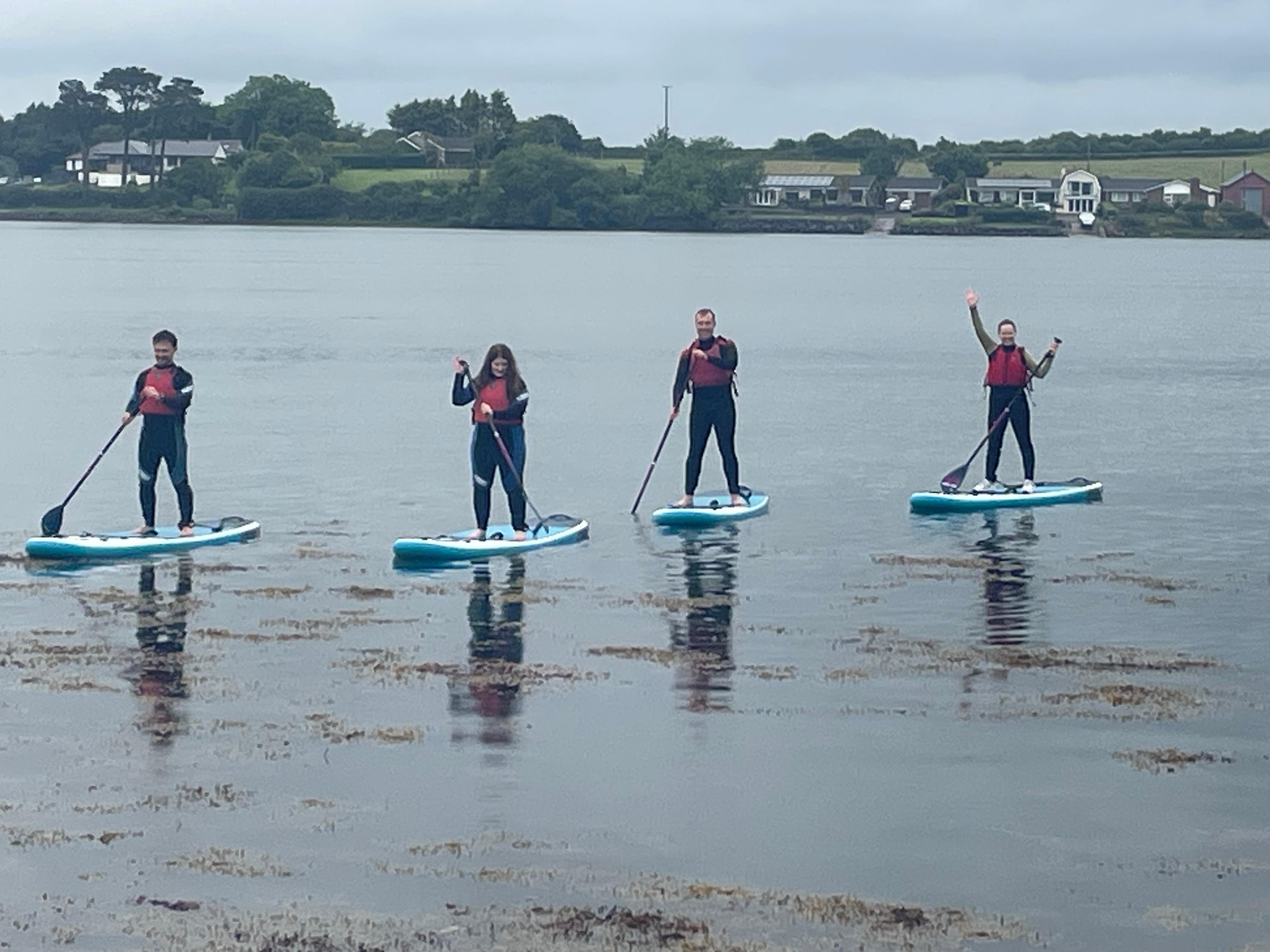 Stand Up Paddling in front of the bungalow