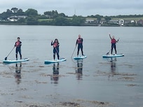 Stand Up Paddling in front of the bungalow