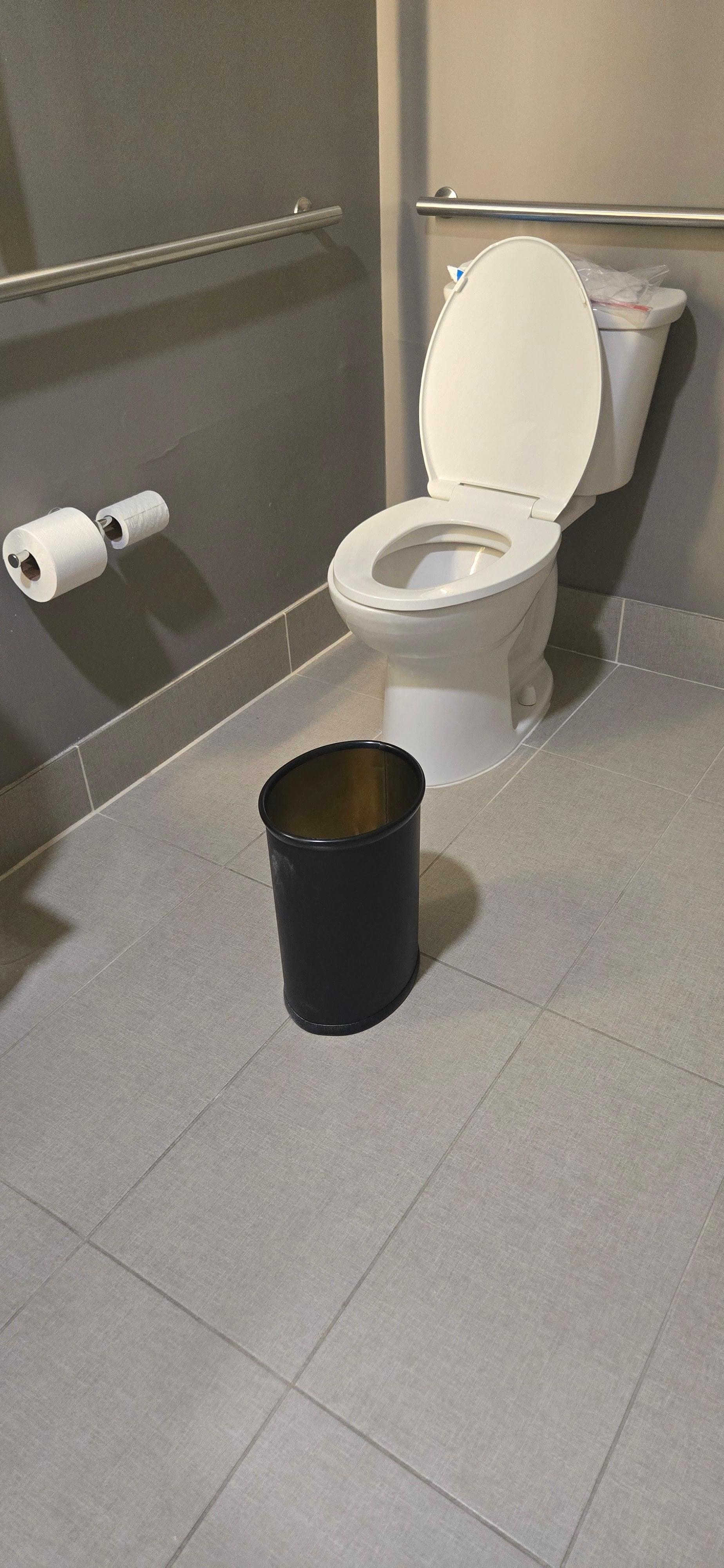 They left the garbage pail in middle of bathroom with no trash liner