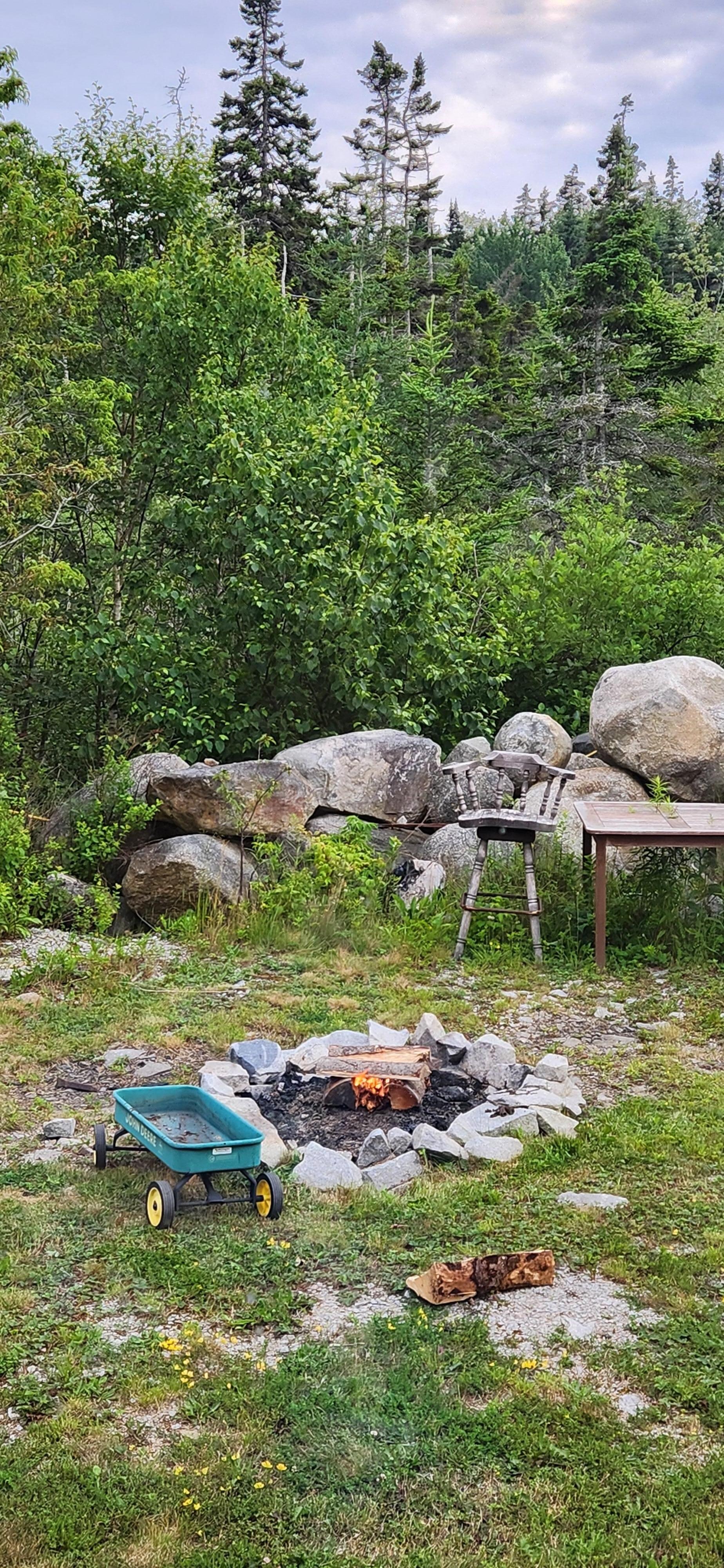 Firepit, grill, seating in the back.