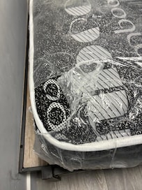 Mattresses are covered in ripped plastic