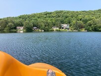 Paddle-boating the length of this beautiful, clean, swimmable lake. Some reeds & neighboring ducks.