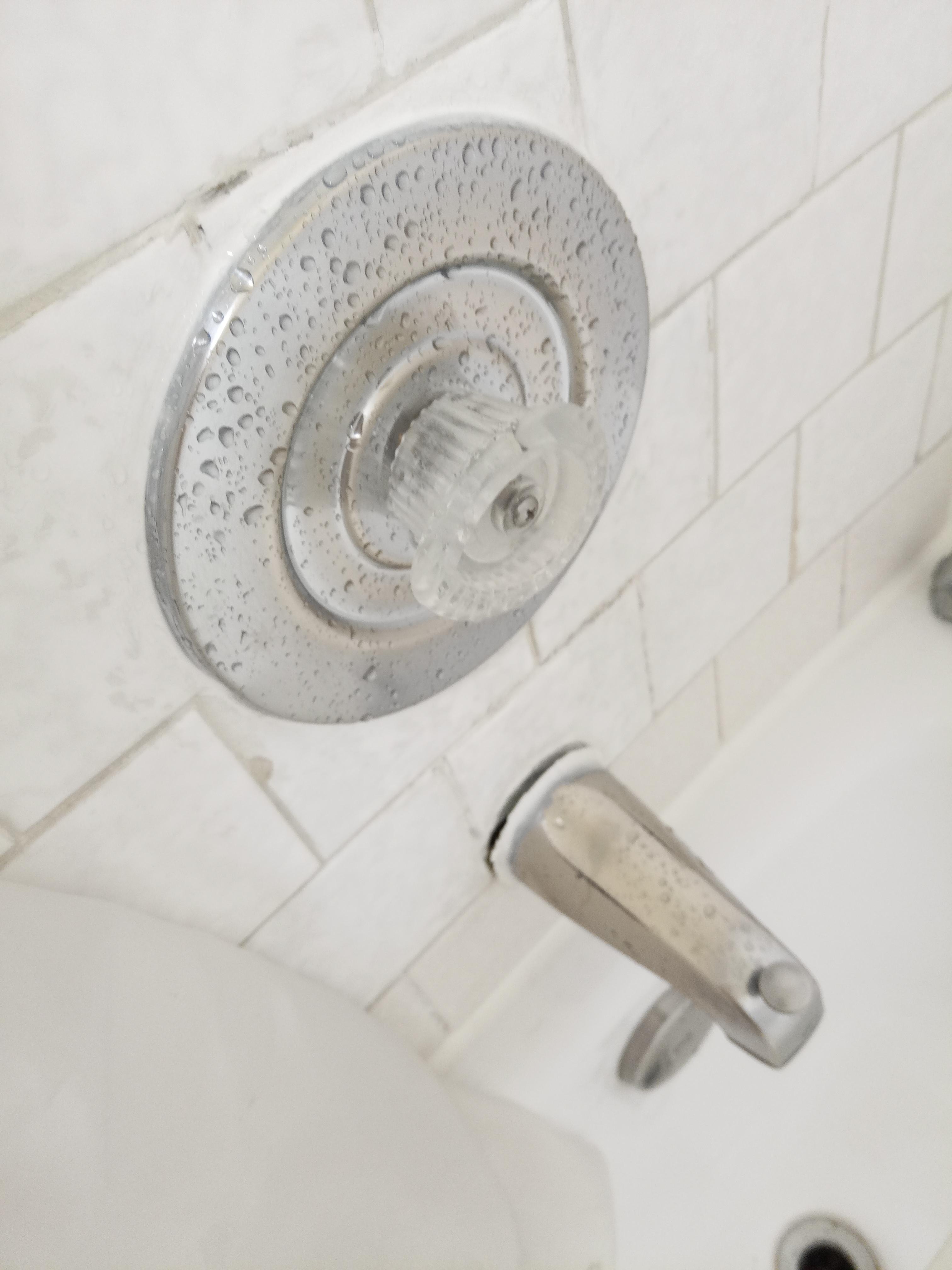 Loose spout and hot and cold not marked.