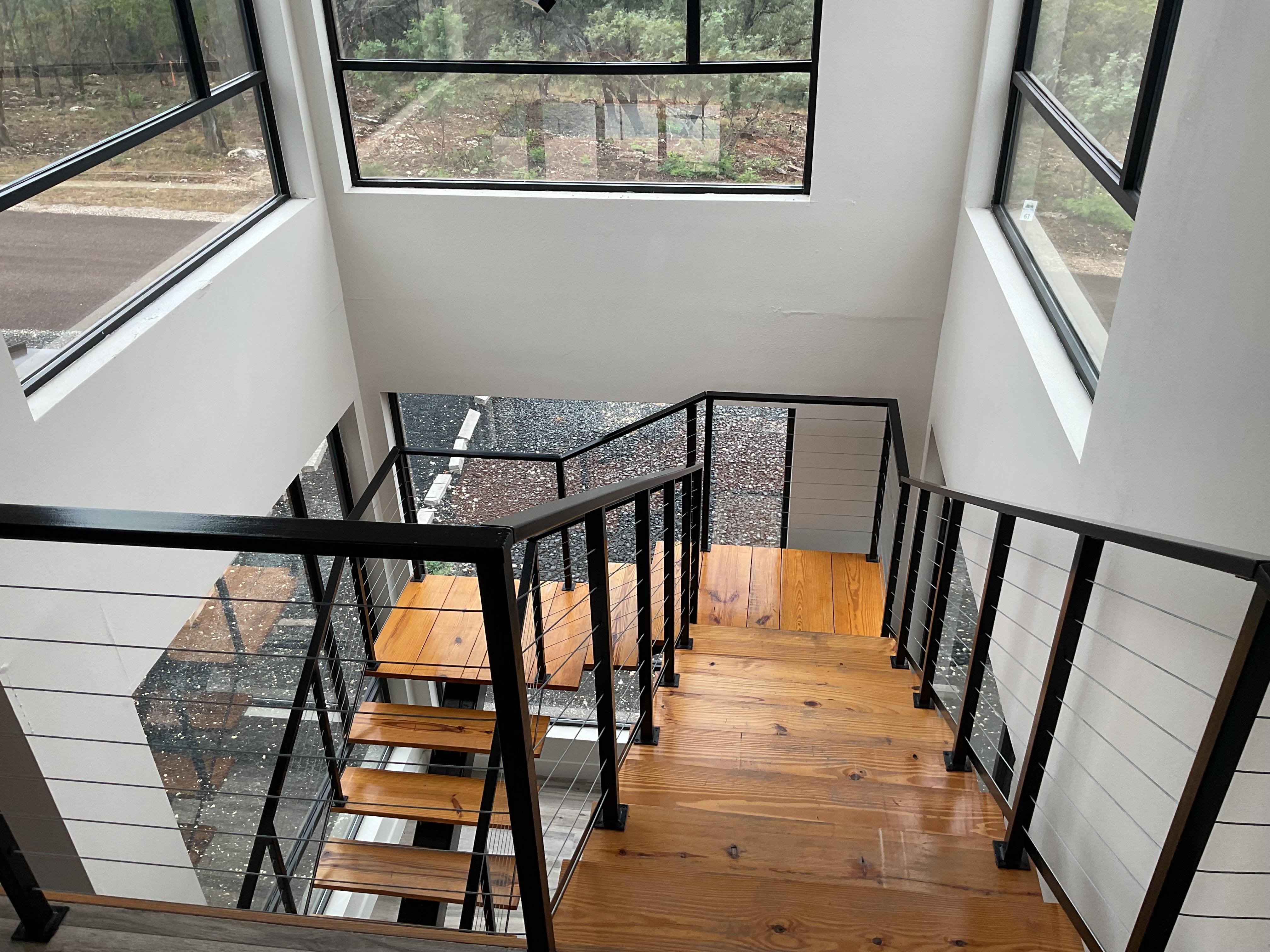 Crisp sturdy lines amidst a feeling of suspension on the floating staircase 