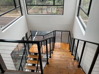 Crisp sturdy lines amidst a feeling of suspension on the floating staircase