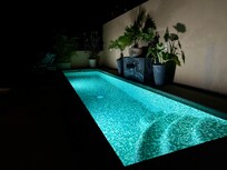 Private pool at property during the evening.