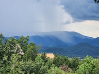 We got to watch a rain storm come across the mountains from the deck.