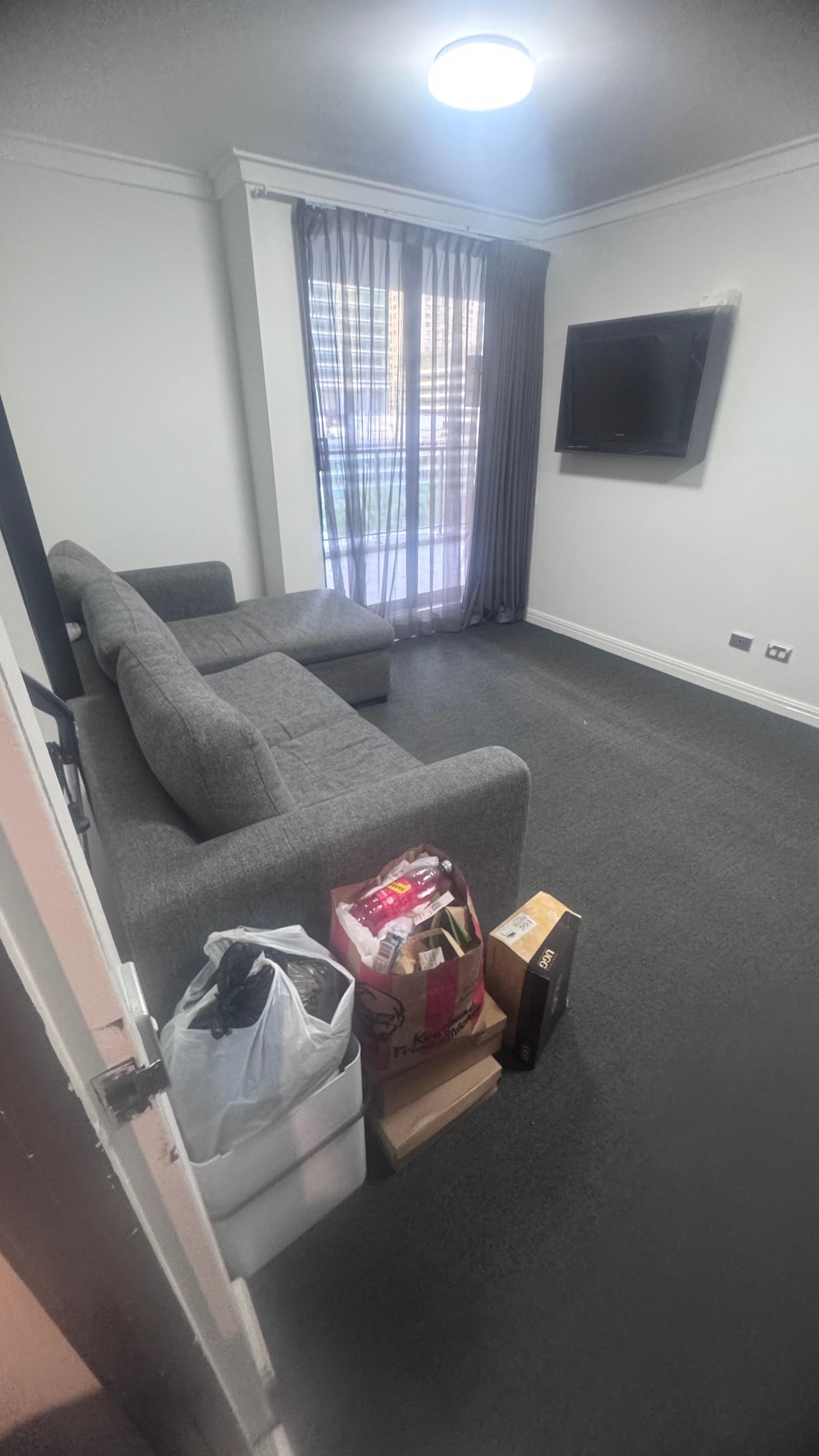 Spacious common space with access to the balcony. There is access to the balcony from both bedrooms, also.