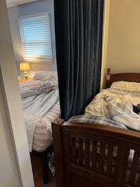 Beds on either side of the curtain - literally side by side
