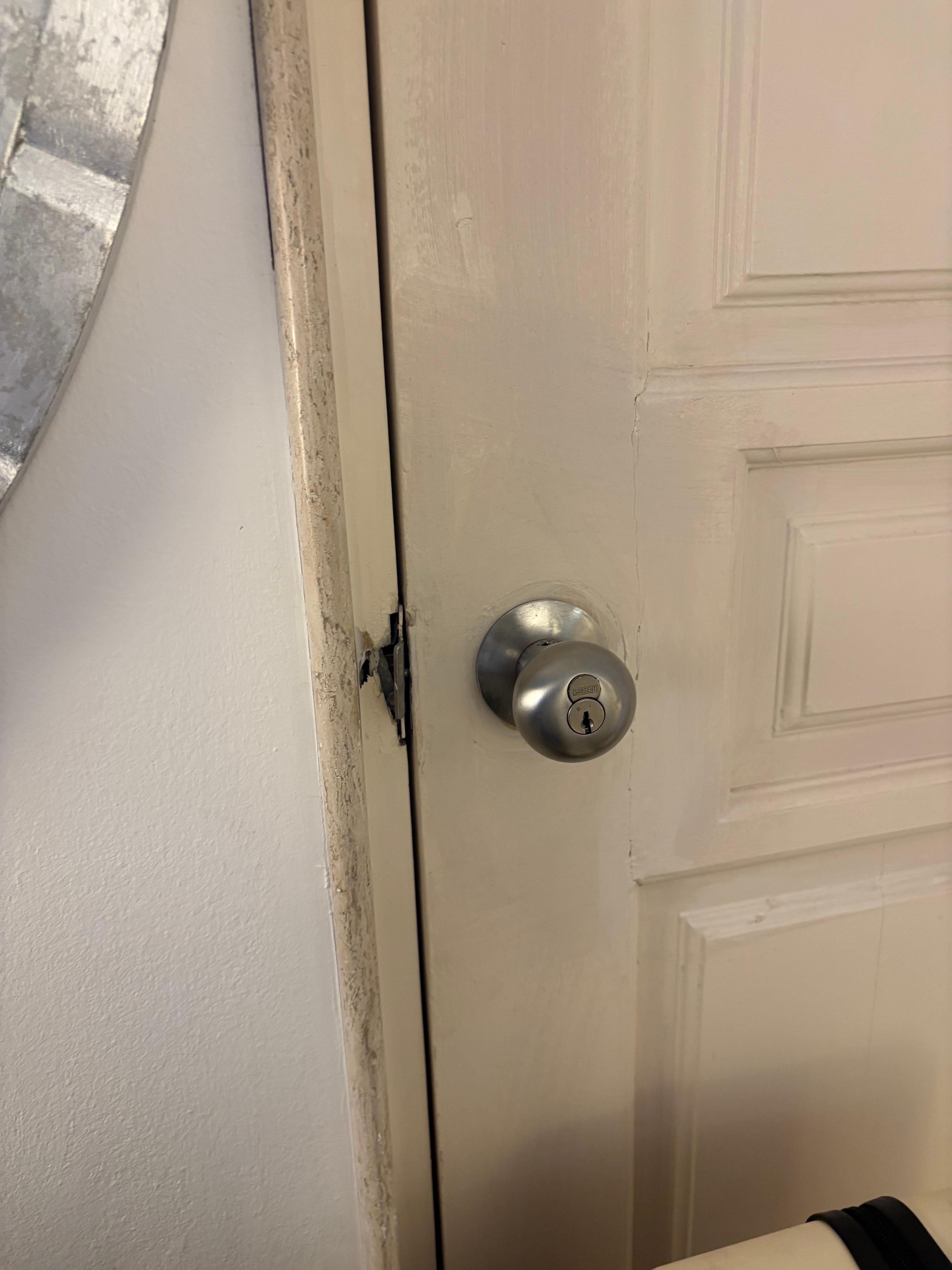 A random door in my room that connects to another room and it looks like it’s been manipulated 