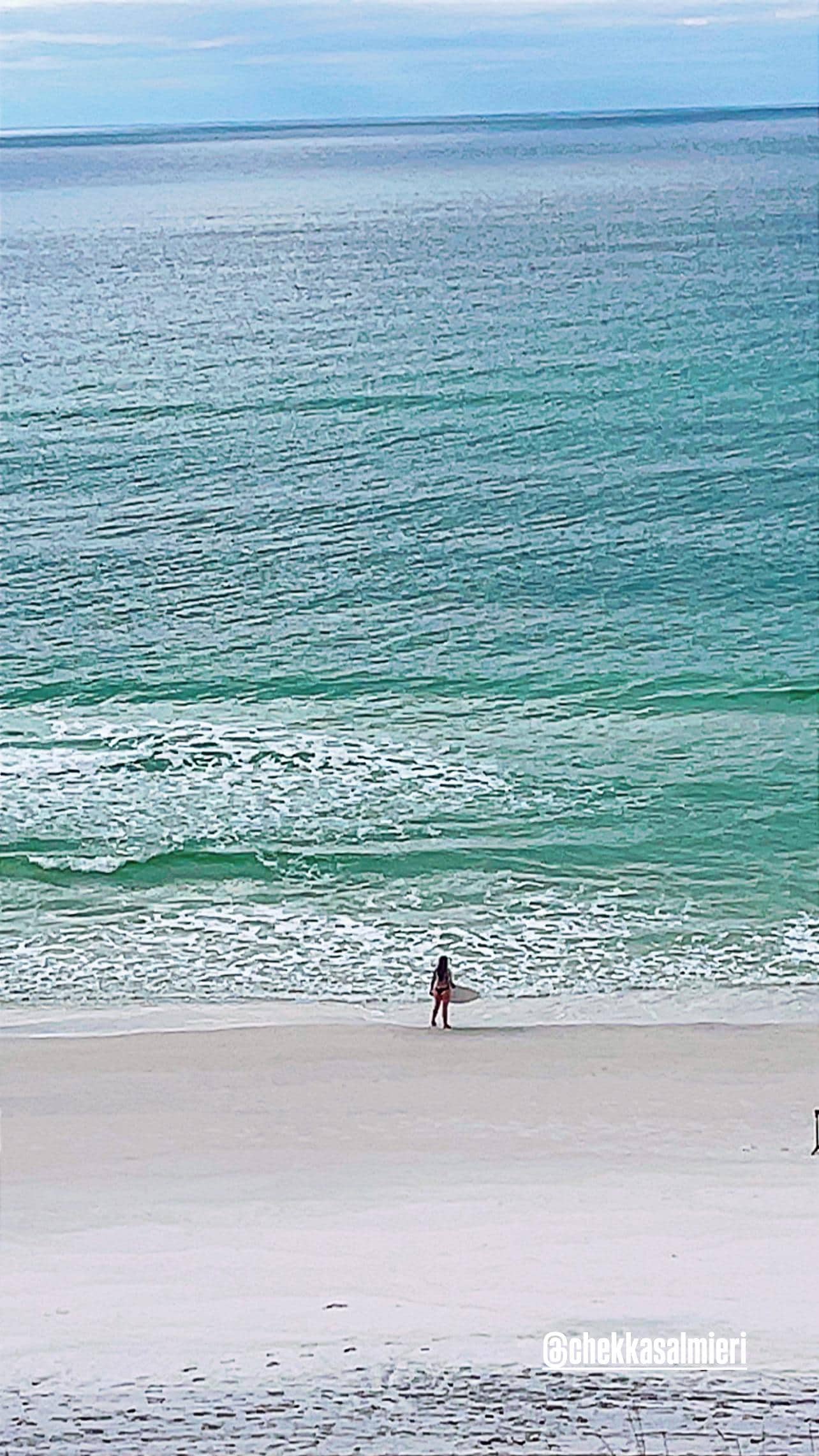 View from condo of My daughter skim boarding in the morning 