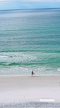 View from condo of My daughter skim boarding in the morning