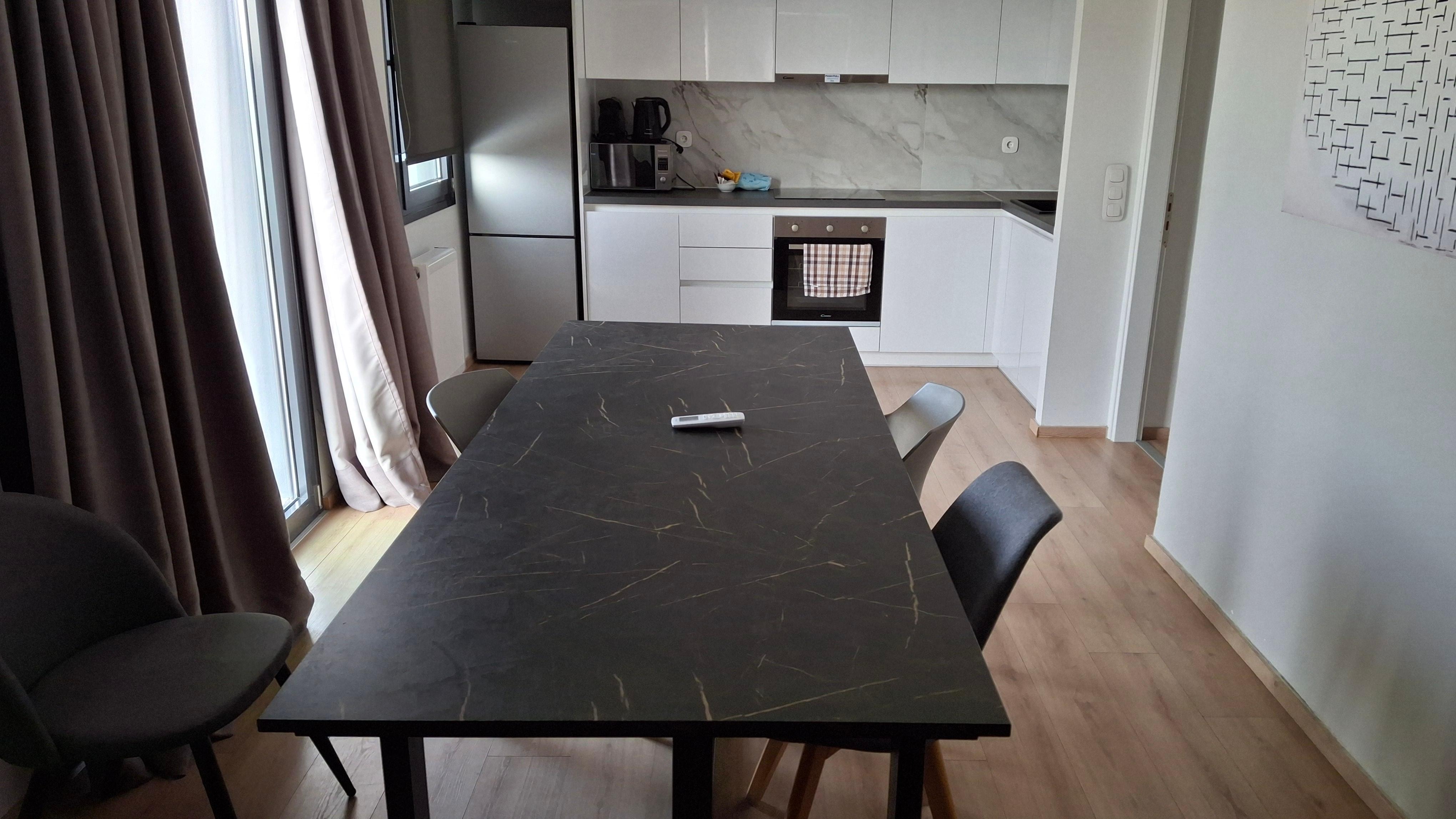 Apartment sleeps 8, but only 4 mismatched dining chairs.