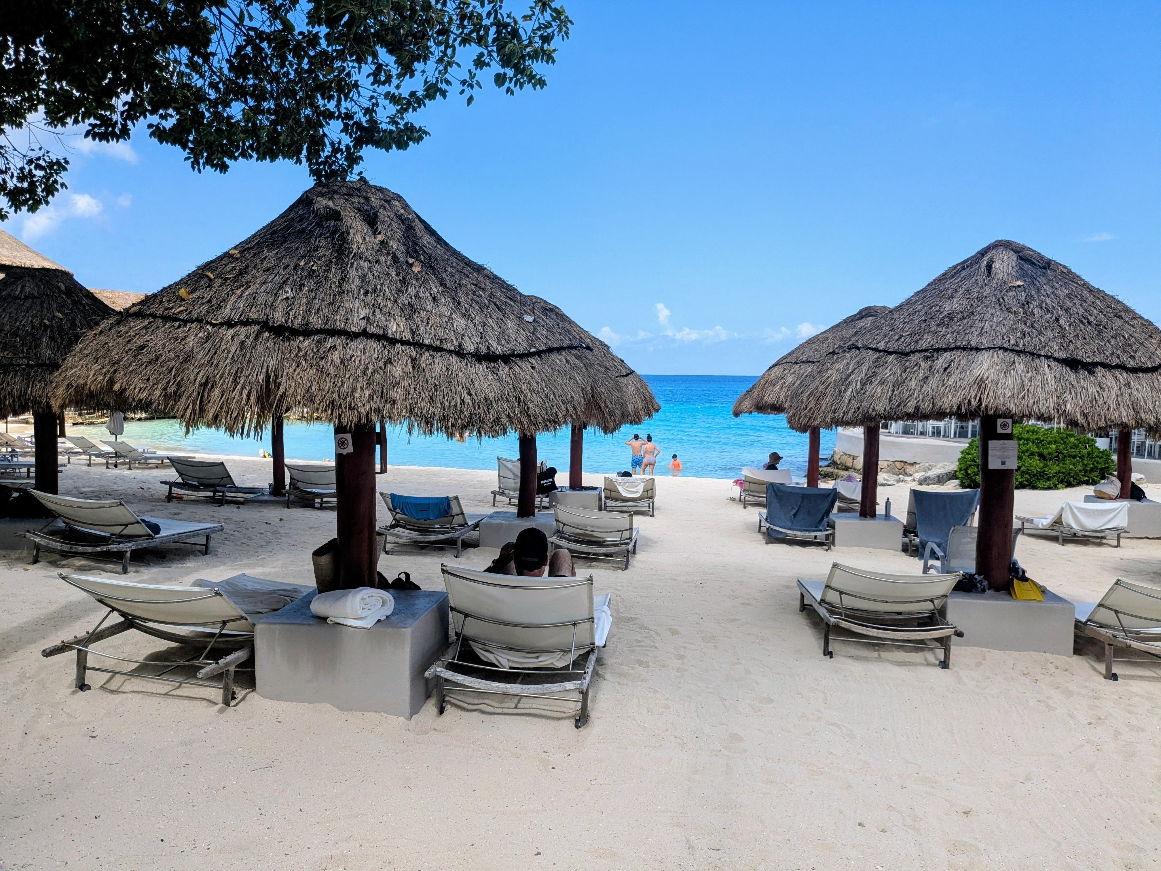 Shaded lounge chairs to relax by the sea, the infinity pool, the hot tub and two outdoor restautants