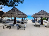 Shaded lounge chairs to relax by the sea, the infinity pool, the hot tub and two outdoor restautants