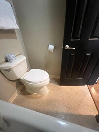TP rack falling apart. Floor โbaseboardsโ grimey.