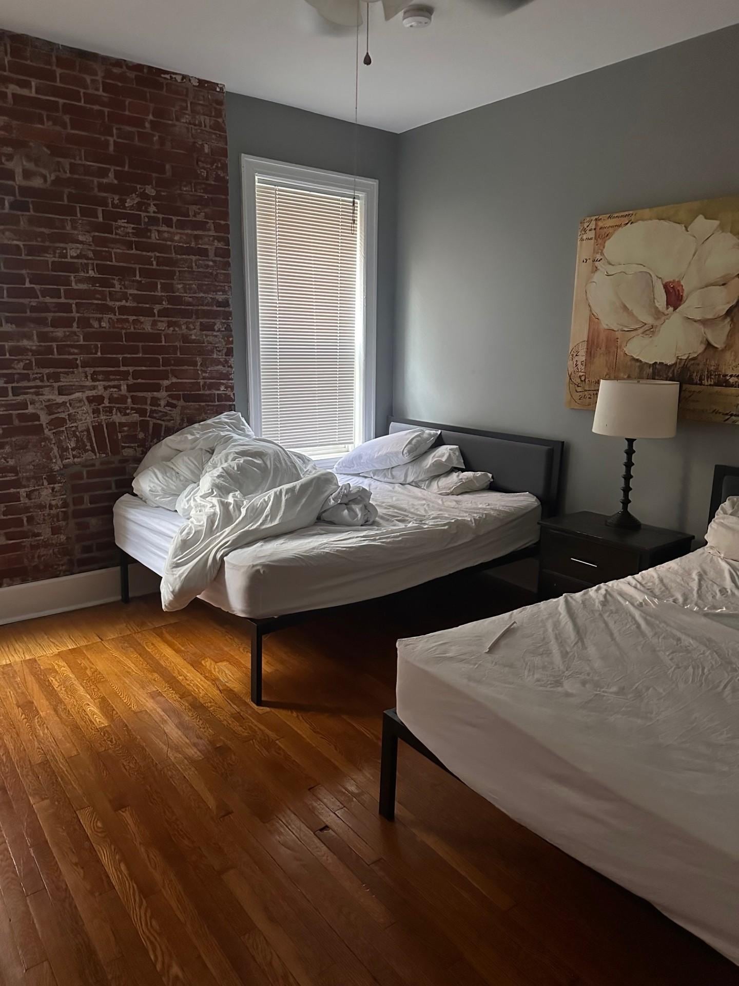 Bedroom #1 with unmade beds