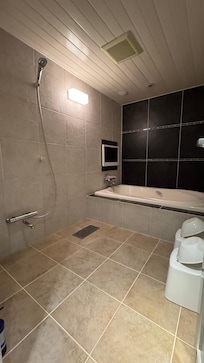 Huge shower and bath. Includes a TV.