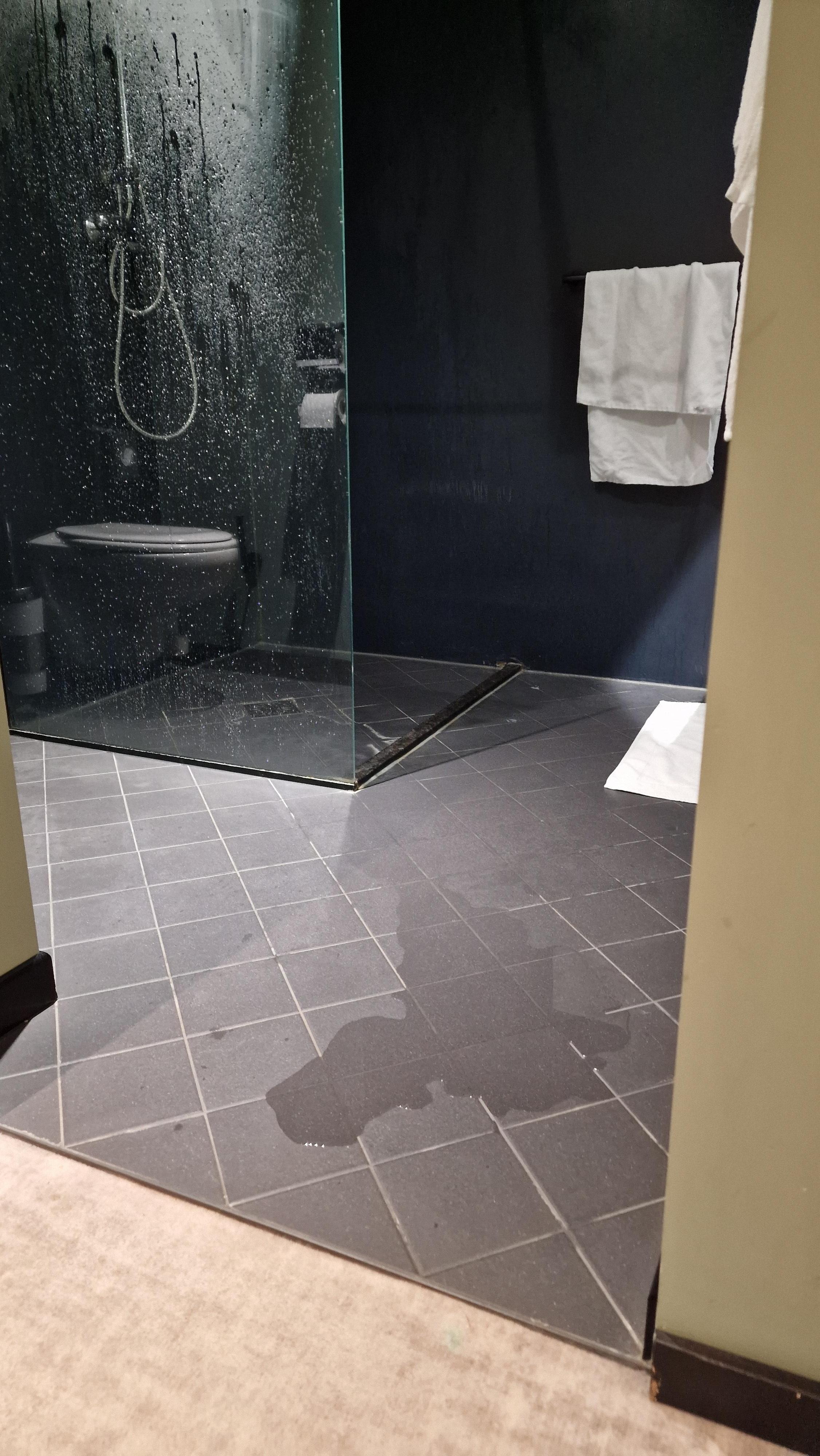Shower drain installed so poorly it floods the whole bathroom