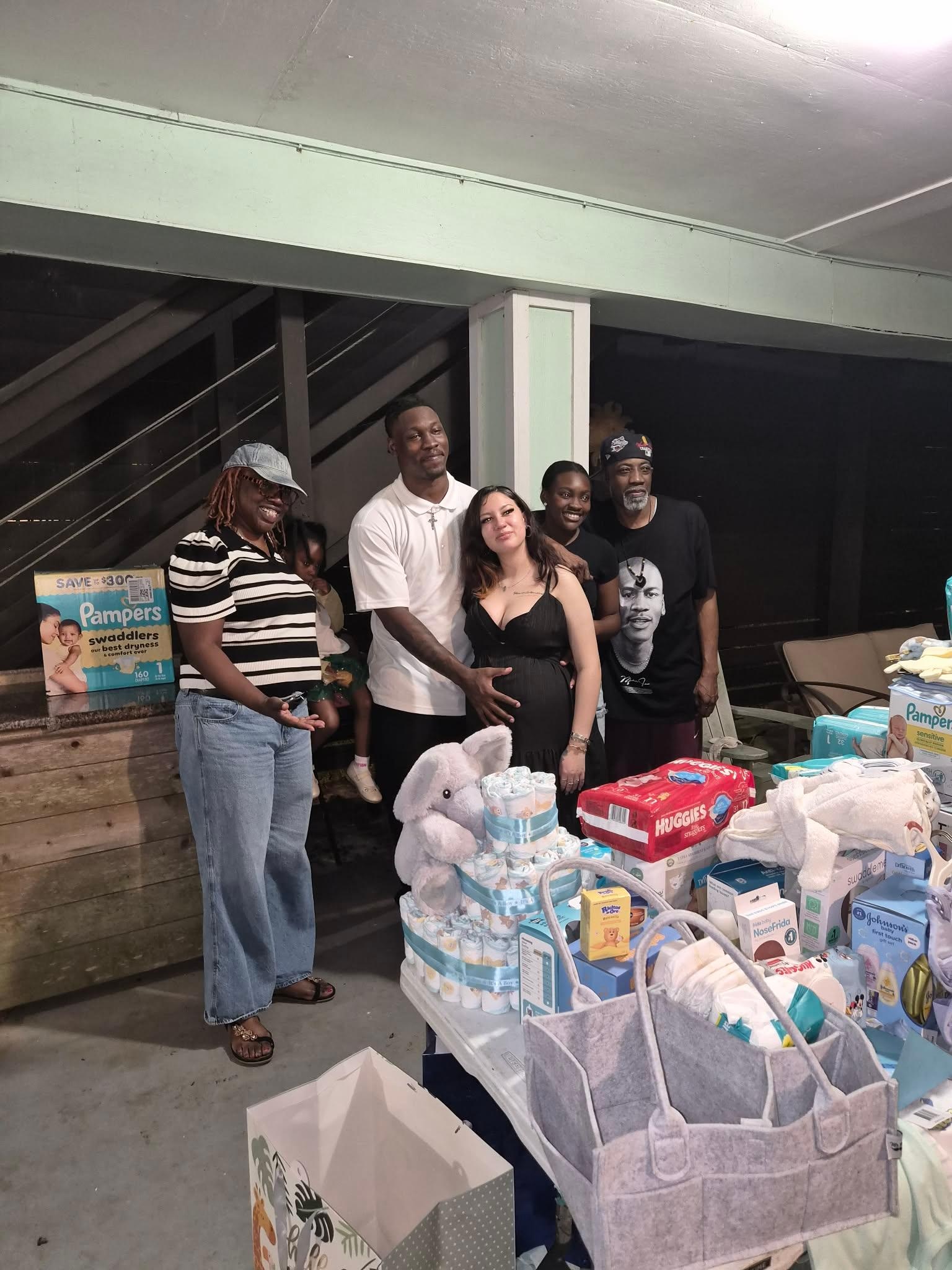 The expecting couple with the soon to be dad's family 